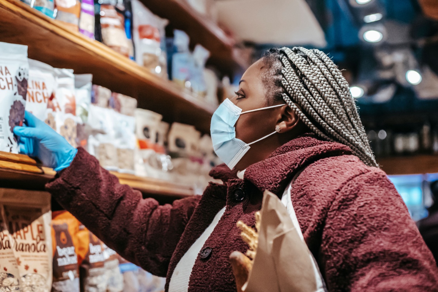 African shopper selecting products in a retail environment